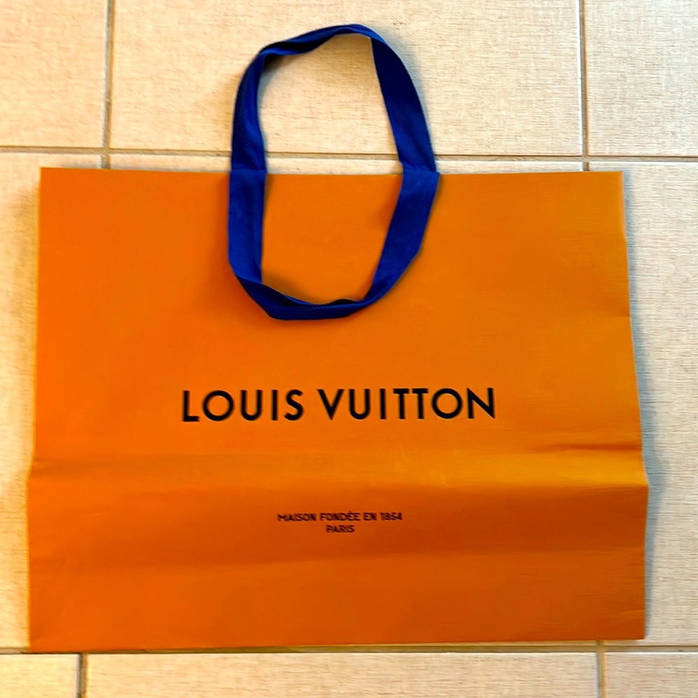 Authentic Louis Vuitton shopping bag with Louis Vuitton pamphlet